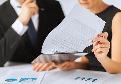 Homebuyers signing a conventional mortgage in NY